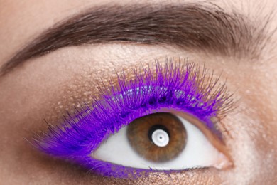 Image of Young woman with beautiful purple eyelashes, closeup
