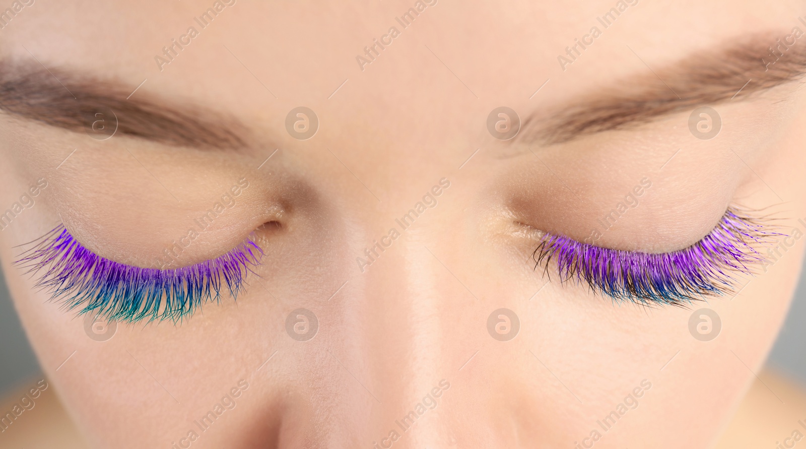 Young woman with beautiful colorful eyelashes, closeup Image of Young woman with beautiful colorful eyelashes, closeup