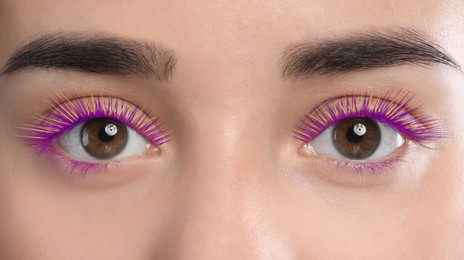 Image of Young woman with beautiful colorful eyelashes, closeup