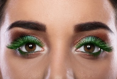 Image of Young woman with beautiful makeup and green eyelashes, closeup