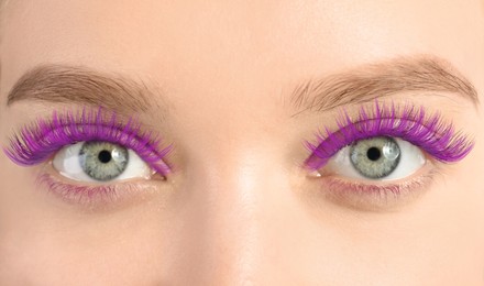 Image of Young woman with beautiful purple eyelashes, closeup