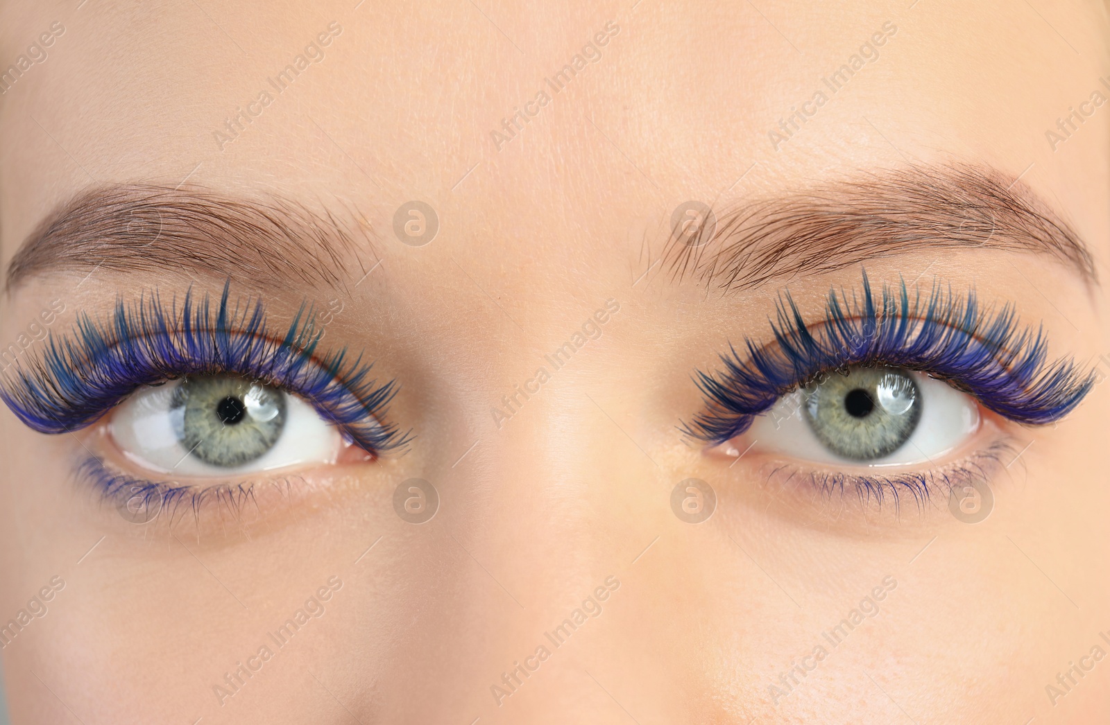 Young woman with beautiful blue eyelashes, closeup Image of Young woman with beautiful blue eyelashes, closeup