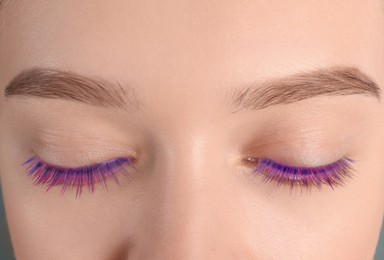 Image of Young woman with beautiful colorful eyelashes, closeup