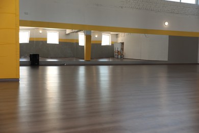 Photo of View of empty studio with mirrors on wall