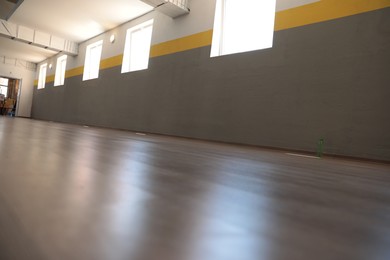 Photo of Empty studio with many windows, ground level view