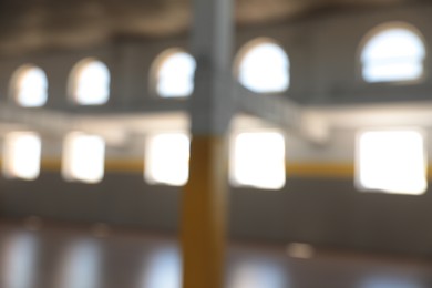 Photo of Blurred view of spacious room with many windows
