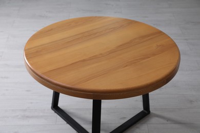 Photo of Empty wooden table indoors, closeup. Stylish furniture
