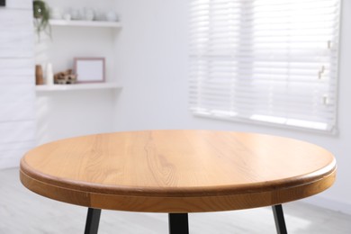 Photo of Empty wooden table indoors, closeup. Stylish furniture