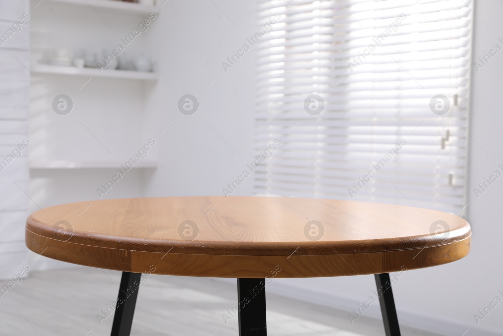 Photo of Empty wooden table indoors, closeup. Stylish furniture