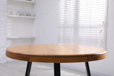 Photo of Empty wooden table indoors, closeup. Stylish furniture