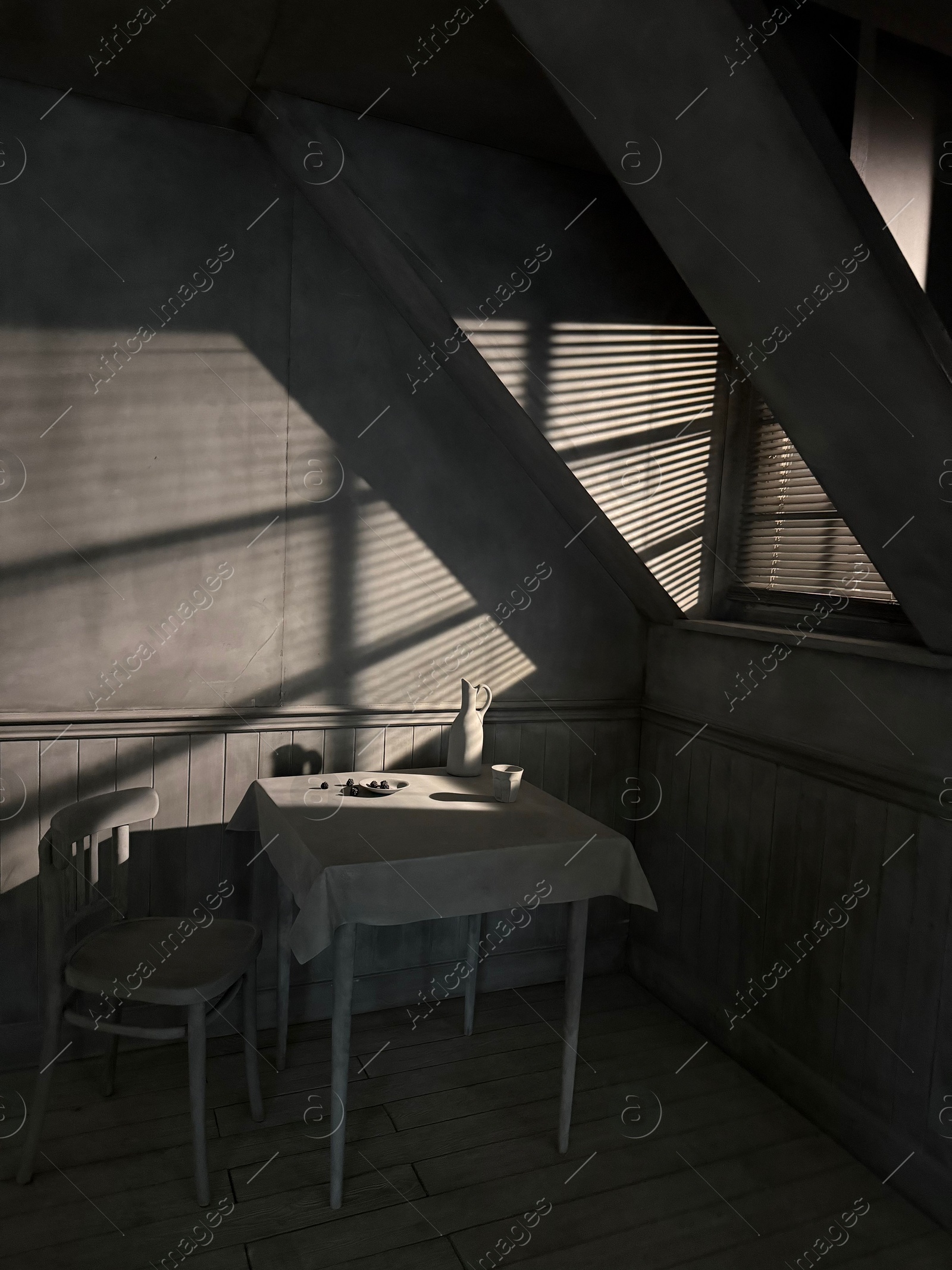 Photo of Wassenaar, Netherlands - April 24, 2025: Installation of attic with table and chair at Voorlinden museum