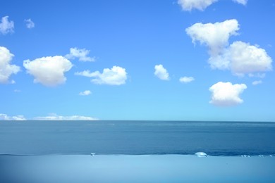 Image of Sea water surface and underwater view. Sky with clouds above
