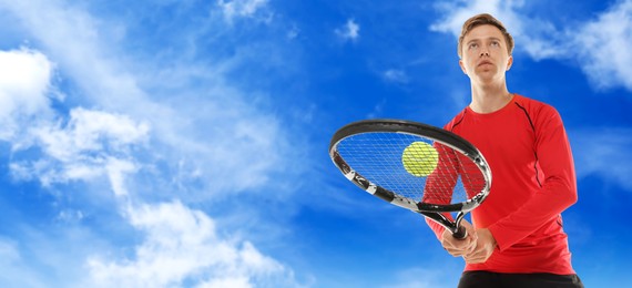 Image of Man playing tennis against blue sky with clouds, low angle view. Banner design