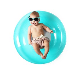 Photo of Cute little baby in sunglasses with inflatable ring on white background, top view