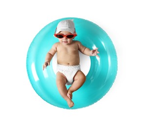 Photo of Cute little baby in sunglasses with inflatable ring on white background, top view