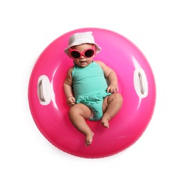 Photo of Cute little baby in sunglasses with inflatable ring on white background, top view
