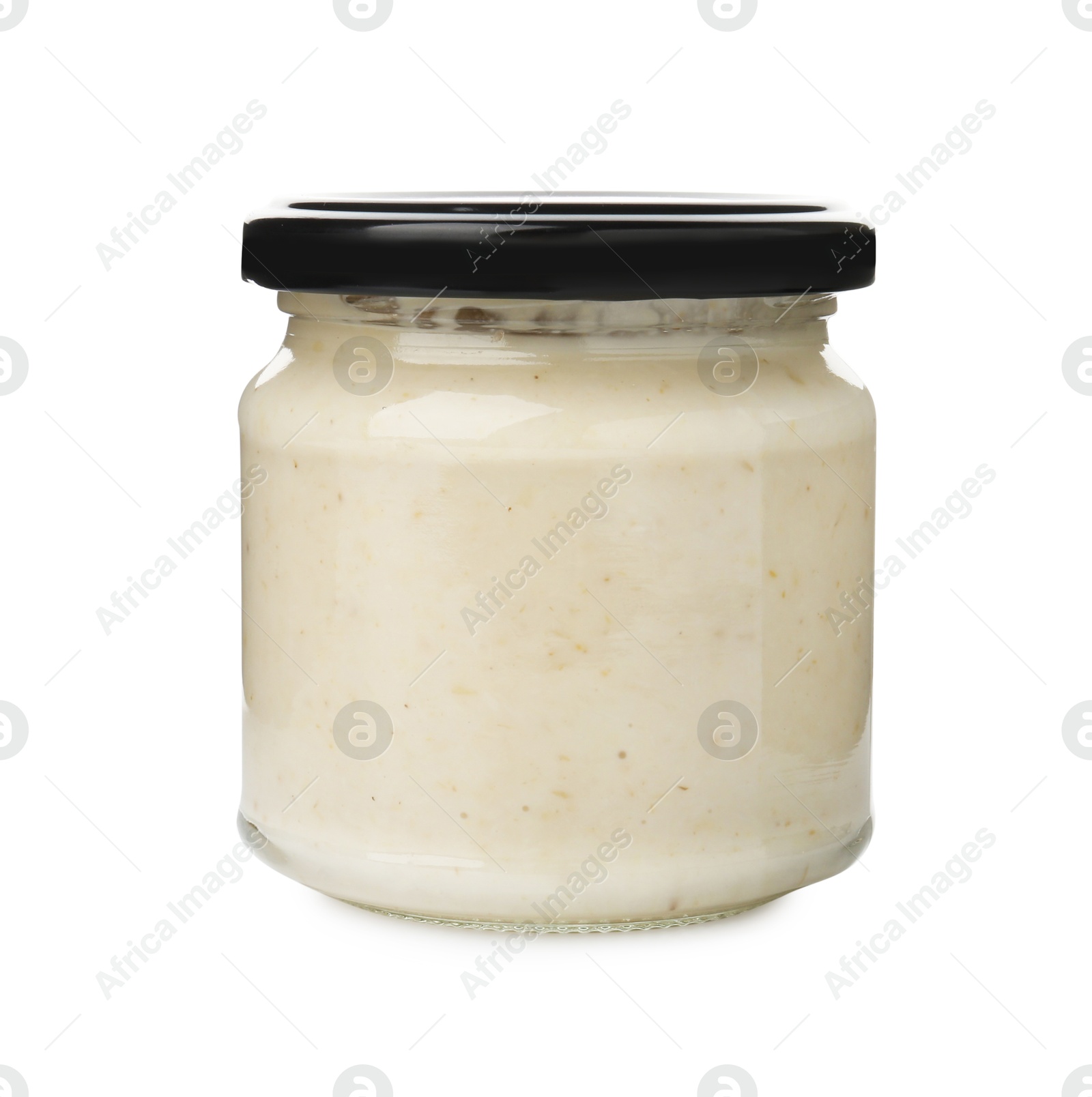 Photo of Tasty horseradish sauce in glass jar isolated on white