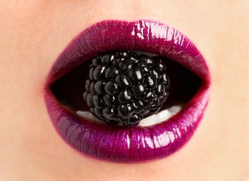 Photo of Woman with beautiful lips makeup and blackberry, closeup