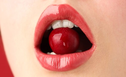Photo of Woman with beautiful lips makeup and cherry, closeup