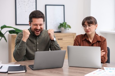 Photo of Woman feeling jealous of her colleague's success in office