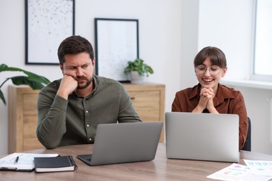 Photo of Man feeling jealous of his colleague's success in office