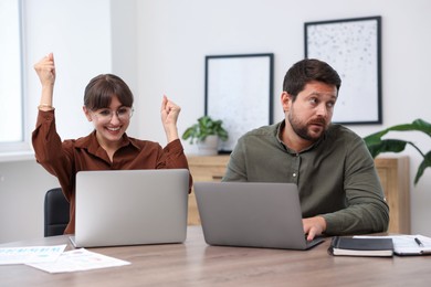Photo of Man feeling jealous of his colleague's success in office