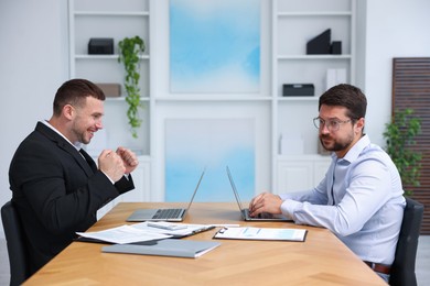 Photo of Man feeling jealous of his colleague's success in office