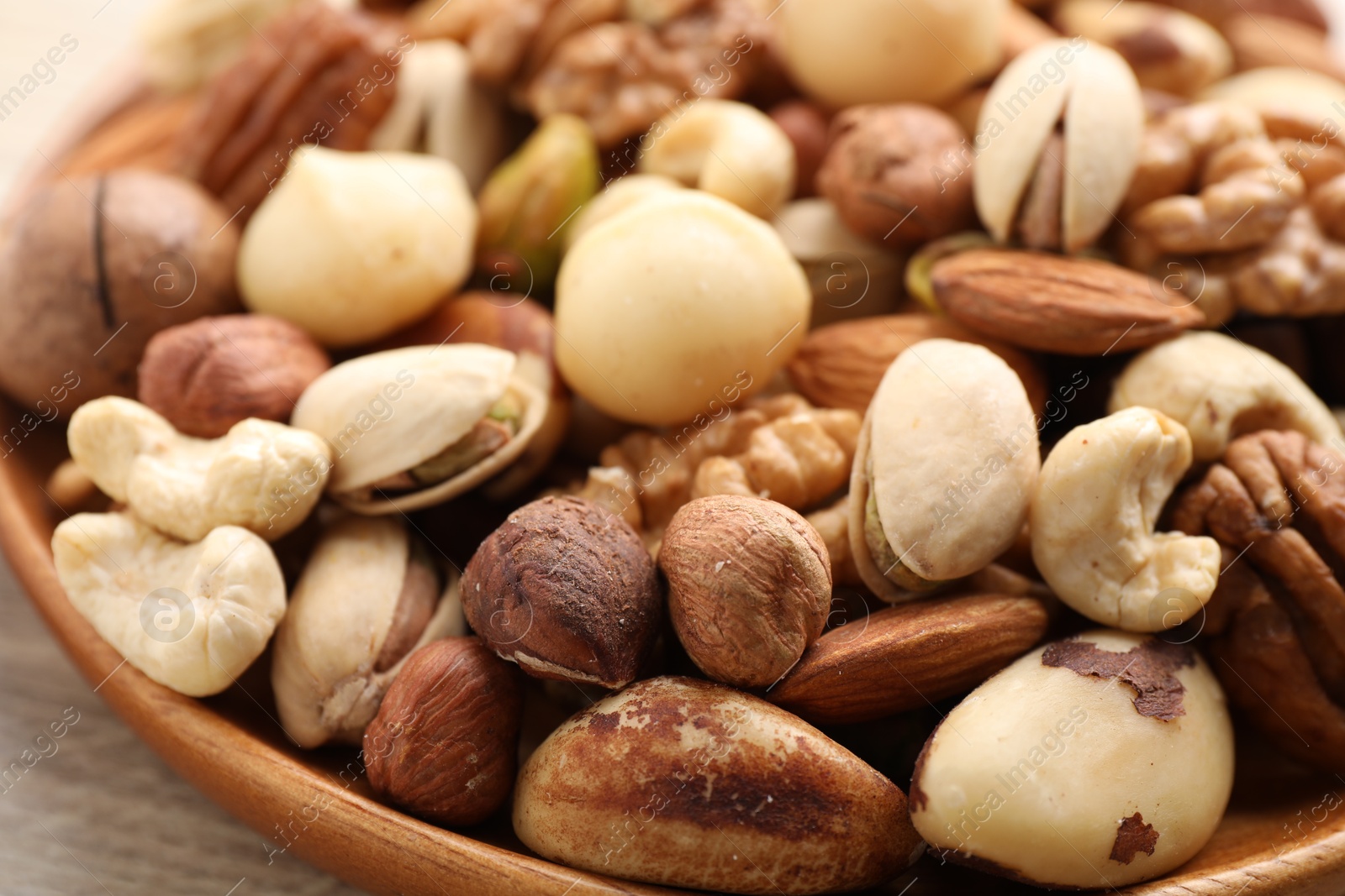 Photo of Mix of different nuts on table, closeup