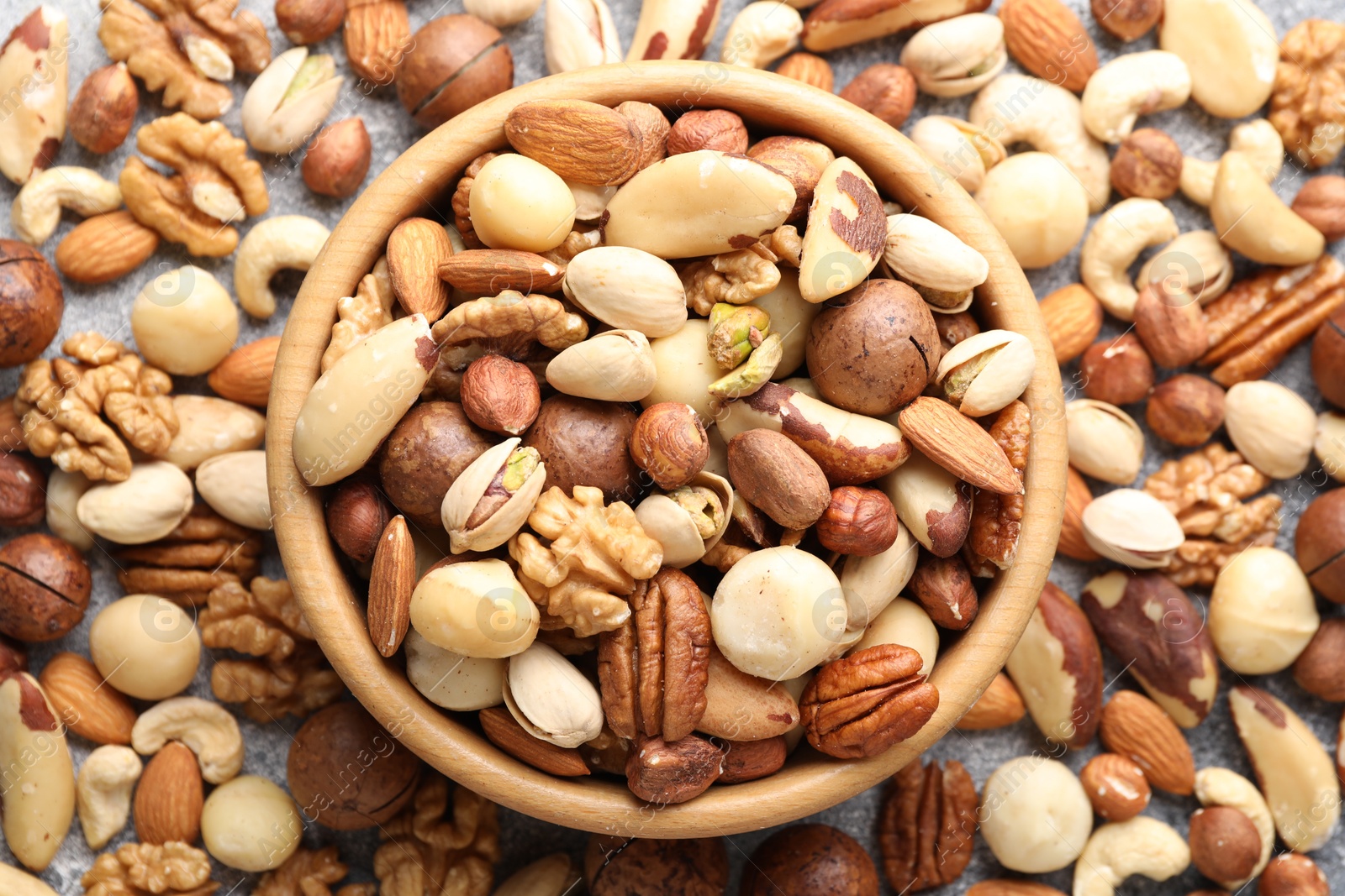 Photo of Mix of different nuts on table, flat lay