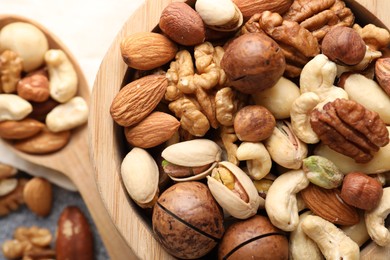 Photo of Mix of different nuts on table, closeup