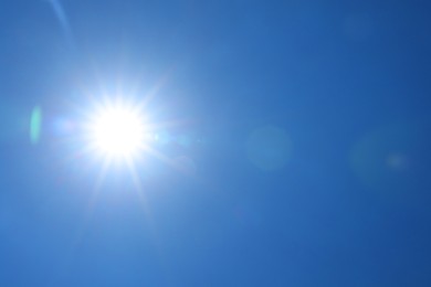 Photo of Bright sun on clear blue sky. Good weather