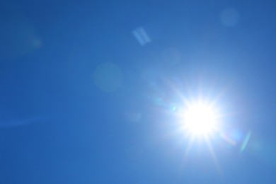 Photo of Bright sun on clear blue sky. Good weather