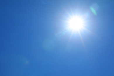Photo of Bright sun on clear blue sky. Good weather