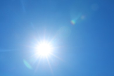 Photo of Bright sun on clear blue sky. Good weather