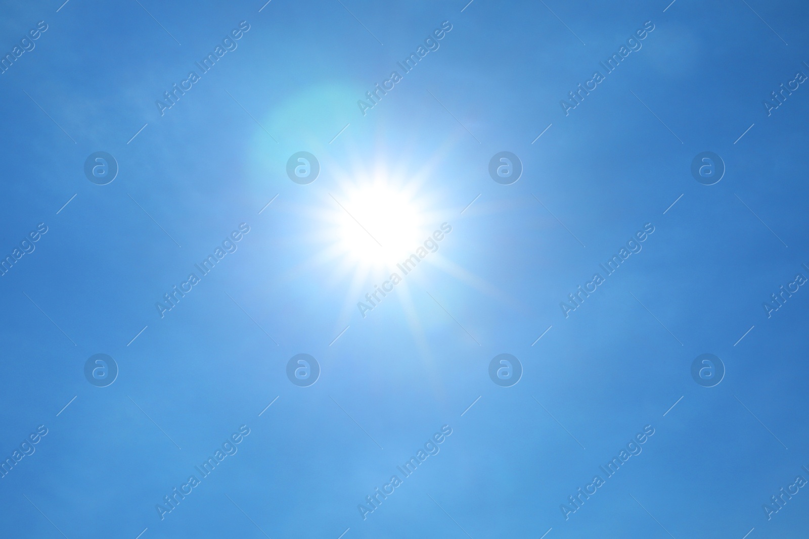 Photo of Bright sun on clear blue sky. Good weather