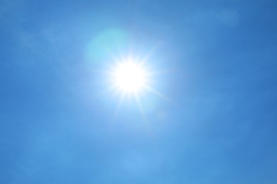 Photo of Bright sun on clear blue sky. Good weather