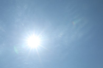 Photo of Bright sun on light blue sky. Good weather