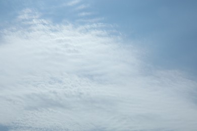 Photo of Light blue sky with fluffy clouds. Cloudy weather