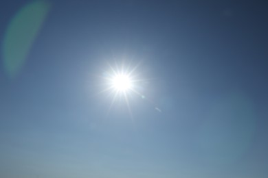 Photo of Bright sun on clear blue sky. Good weather