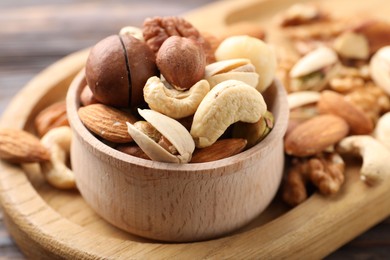Photo of Mix of different nuts on table, closeup