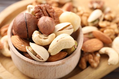 Photo of Mix of different nuts on table, closeup