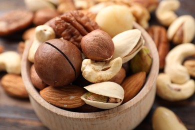 Photo of Mix of different nuts on table, closeup