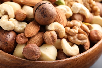 Photo of Mix of different nuts in bowl, closeup