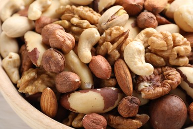 Photo of Mix of different nuts in bowl, closeup