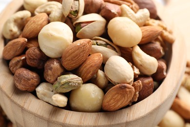 Photo of Mix of different nuts in bowl, closeup
