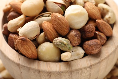 Photo of Mix of different nuts in bowl, closeup