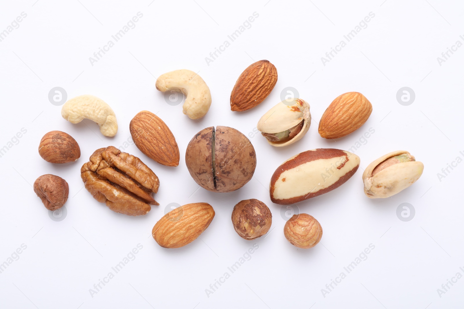 Photo of Mix of different nuts on white background, flat lay
