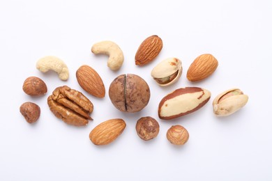 Photo of Mix of different nuts on white background, flat lay