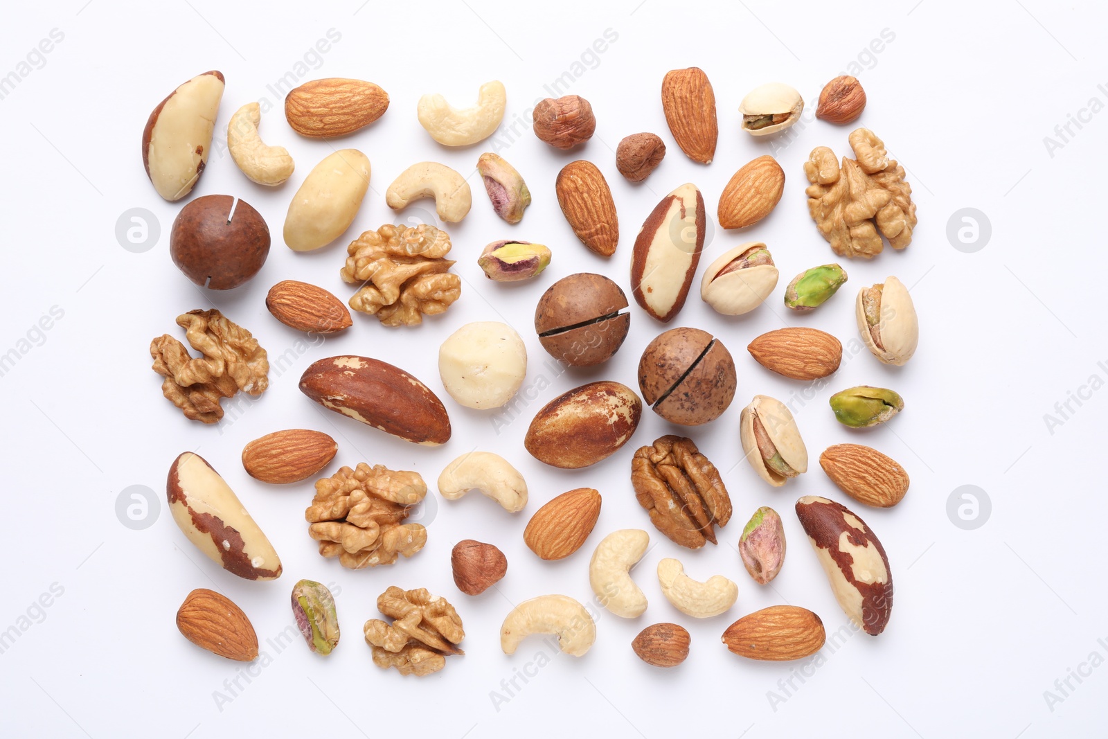 Photo of Mix of different nuts on white background, flat lay