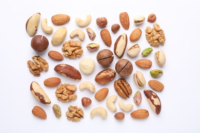 Photo of Mix of different nuts on white background, flat lay
